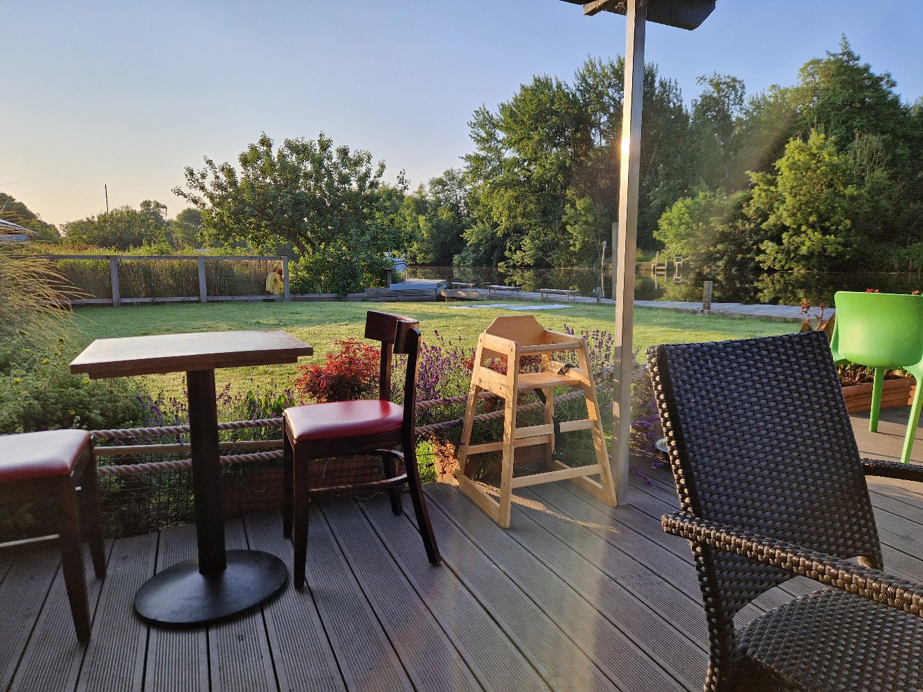 Early morning view from the café deck across the lawn to the river